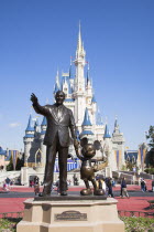 Walt Disney World Resort. Walt Disney and Mickey Mouse Partners statue in front of Cinderella s castle in the Magic Kingdom.TravelTourismHolidayVacationExploreRecreationLeisureSightseeingTour...