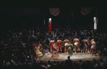 Sumo wrestlers of the top division perform the dohyo-iri ring entry ceremony before crowd of spectators before a Grand Championship fight.
