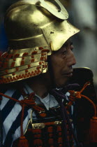 Portrait of Samurai wearing armour constructed of plates of metal or bamboo held together with coloured lacing   intended to be elegant in appearance while still giving protection from arrows and swor...
