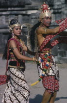 Couple in elaborate costume performing Ramayana dance.