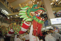 Chinese New Year celebrations. Chinese dragon dancers inside Warorot Market  Chiang Mais China Town