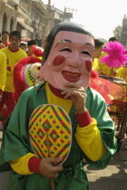 Chinese New Year celebrations. Dwarf in parade  Warorot Market area Chiang Mais China Town