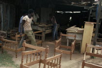Workers in furniture workshop.
