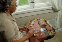 Woman making lace.