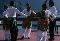 Children performing traditional dance in costume.