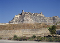 The Castle of San Felipe de Barajas with steep sided walls and crenellated battlements.