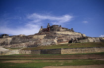 The Castle of San Felipe de Barajas with steep sided walls and crenellated battlements.