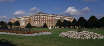 Hampton Court Palace. General view seen across formal gardens