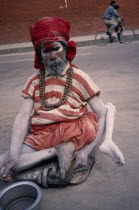 Crippled Sadhu / Holy Man begging