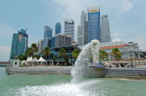 MERLION STATUE SITUATED INFRONT OF THE FULLERTON HOTEL AND FINACIAL DISTRICT BEHIND. The Merlion is one of the most well-known tourist icons of Singapore. Its landmark statue  once at the Merlion Park...