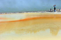 tHE CHAMPAGNE POOL OF WAI O TAPU THERMAL WONDERLAND.THE SPRING IS 65 METRES IN DIAMETER AND 62 METRES DEEP.THE POOL WAS FORMED 700 YEARS AGO BY A HYDROTHERMAL ERUPTION.VARIOUS MINERALS ARE DEPOSITED A...