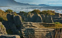 GEOLOGICAL FEATURED ROCKS CALLED THE PANCAKE ROCKS BLOWHOLES AT DOLOMITE POINT  PUNAKAIKI ON THE SOUTH ISLAND WEST COAST.THE ROCK HAS SPLIT INTO HORIZONTAL LAYERS TO RESEMBLE A TOWER OF PANCAKES.Anti...