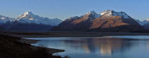 MOUNT COOK NATIONAL PARK  VIEW OF NEW ZEALANDS HIGHEST MOUNTAIN MOUNT COOK  LEFT  AND MOUNT JOHNSON  RIGHT  WITH EVENING SUN ON THEIR WEST FACES WITH LAKE PUKAKI BELOW TAKEN FROM ROUTE 80 MOUNT COOK R...