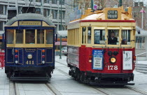 CANTERBURY  CITY TOUR TRAMS AT A TRAM STOP IN CATHEDRAL SQUARE.Antipodean Oceania