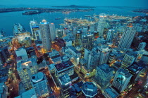 GENERAL VIEW OF AUCKLAND CITY CENTRE AT DUSK FROM THE AUCKLAND SKY TOWER WITH VIEWS ACROSS AUCKLAND HARBOUR TO THE DISTRICT OF DEVENPORT AND RANGITOTO ISLAND BEHIND.Antipodean Oceania Blue Center