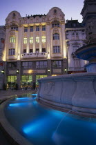 Part view of Maximillian Fountain and the Cafe Rolanda on Hlavne nam  main square  at night.