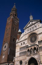 Piazza del Comune.  Part view of the Duomo facade and rose window beside medieval bell tower known as the Torrazzo and linked together by a Renaissance loggio.