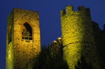 Manerba di Garda.  Castello crenellated walls and bell / clock tower illuminated at night.