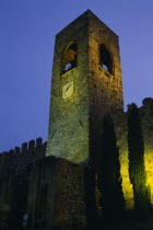 Manerba di Garda.  Castello crenellated walls and bell / clock tower illuminated at night.