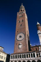 Piazza del Comune.  Medieval bell tower known as the Torrazzo linked by a Renaissance loggia to the Duomo.  Clock on exterior featuring the signs of the zodiac.