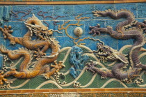 Beihai Park.  Detail of Nine Dragon Screen constructed from coloured  glazed tiles and originally used to give protection from evil spirits to temple  now disappeared .