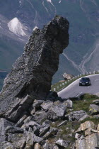 Witches Kitchen rock formation above car on Grossglockner Road in mountain range forming part of the Eastern Alps.