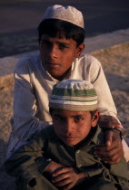 Head and shoulders portrait of two  young Muslim boys.