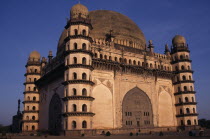 The Golgumbaz.  Exterior of domed building with octagonal seven-storey towers at each corner.  Built in 1659 as the mausoleum of Mohammed Adil Shah.