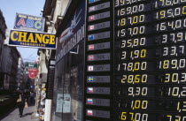 Exchange rates listed outside shop offering money changing service.