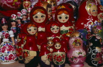 Colourful painted matryoshka dolls for sale in souvenir shop.