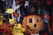 Display of masks and costumes for Halloween in shop on West 34th Street.