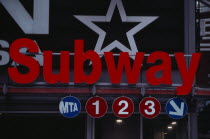 Red subway sign on 34th Street / 7th Avenue.