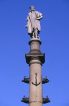 Columbus Circle.  Marble statue of Columbus on granite column decorated with bronze reliefs designed by sculptor Gaetano Russo. Erected to commemorate the 400th anniversary of Columbus  first voyage...