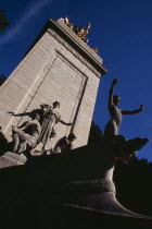 The Maine Monument  at the Merchants Gate entrance to Central Park.  Limestone pylon crowned with gilded bronze statue of Columbia triumphant.  Dedicated to the 260 seamen who died on the battleship...