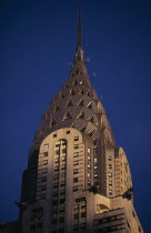 Part view of the Chrysler Building from Lexington Avenue.  Steel framed Art Deco skyscraper built 1928-1930.  Designed by architect William Van Alen.