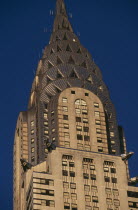 Part view of the Chrysler Building from Lexington Avenue.  Steel framed Art Deco skyscraper built 1928-1930.  Designed by architect William Van Alen.