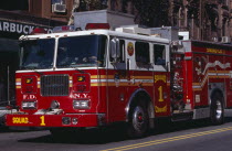 New York fire department truck on street.