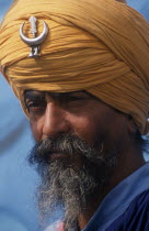 Portrait of Nihang a member of the Sikh Warrior caste wearing his ceremonial turban at the Rural Sports Festival