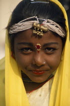 Head and shoulders portrait of a young girl dancer at the Alwar Utsav Festival
