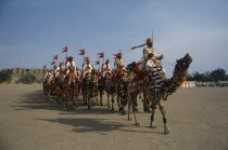 Border Security Force soldiers performing the Camel Tattoo at the Desert Festival