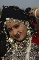 Head and shoulders portrait of a Miss Desert contestant  wearing traditional jewellery at the Desert Festival