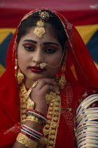 Portrait of a Miss Desert contestant wearing red with traditional jewellery at the Desert Festival