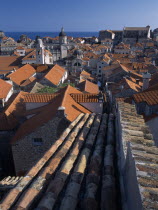 Elevated view over terracotta roof tops towards the Cathedral  St Blaise s Church and clock tower in morning light.