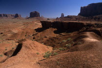 John Ford Point on Valley Drive with lone figure on horseback overlooking mesas  buttes and desert floor.