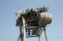 Female soldier in air raid look-out tower.