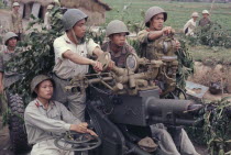 North Vietnamese soldiers with anti aircraft missile launcher.