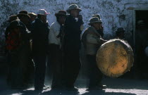 Musicians at village fiesta.  The second band member plays traditional pan-flute or  zampona .