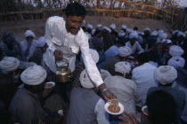 Chai being served at a Moslem wedding in village in the Thar Desert.