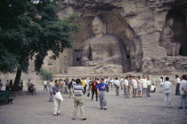 Yungang Caves.  Chinese visitors at ancient Buddhist site with rock carvings dating from AD 386 - 534.