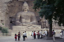 Yungang Caves.  Chinese visitors at ancient Buddhist site with rock carvings dating from AD 386 - 534.